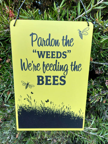 Sign - Pardon the weeds...